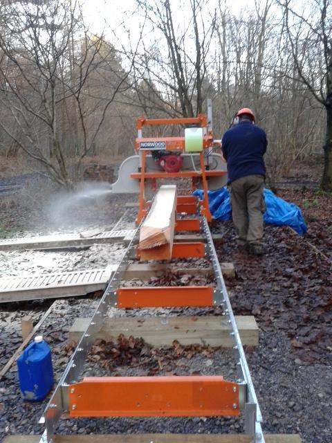 our saw mill at work cutting ash boards