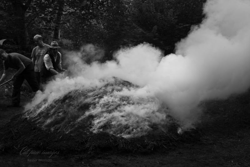 Charcoal Production - a traditional earth burn being carried out for demonstration, but still practiced across large parts of the world