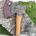 axe and sheath - an axe in a brown leather sheath