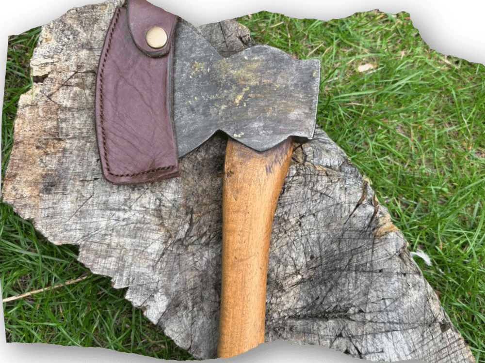 axe and sheath - an axe in a brown leather sheath
